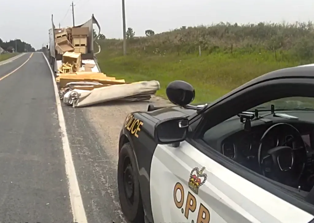 Transport truck damages Ontario railway bridge; driver faces charges